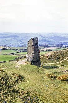 People climbing Alport Stone, Alport Heights, Wirksworth, Peak District National Park, Derbyshire, England, UK 1956