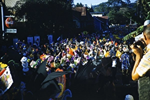 People in colourful costumes at the carnival parade, Port of Spain, Trinidad 1963 with the title Bats and Clowns