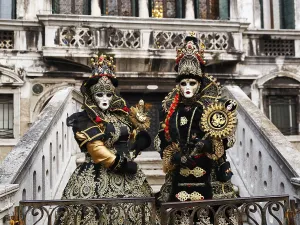 Two people in costume posing on a staircase