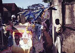 People dressed in colourful costumes for the carnival procession, Port of Spain, Trinidad 1962