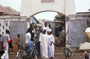 People at the entrance gate to the Royal Albert Market, Banjul, Gambia, Africa, 1978, Africa