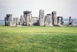 People exploring the standing stones at the Neolithic site of Stonehenge, Wiltshire, England, UK 1961