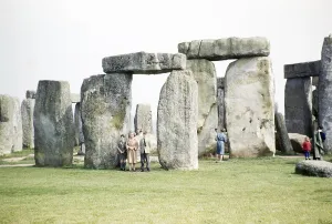 People exploring the standing stones at the Neolithic site of Stonehenge, Wiltshire, England, UK 1961
