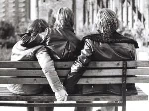 Three people in flit, ca. 1980s