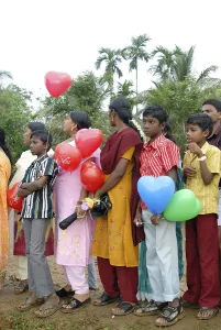 People holding balloons and celebrating festival