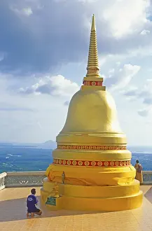 People, man praying, chedi in Wat Tam Sua monastery