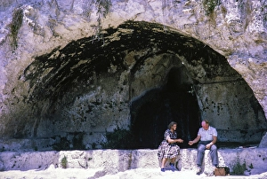 People sitting in rock cut niche at fifth century BC, Greek Theatre at Syracuse, Sicily, Italy, Europe 1969, Europe