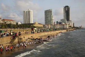People on small sandy beach at Galle Face Green