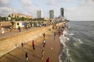 People on small sandy beach at Galle Face Green