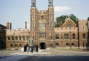 People by the statue of the founder King Henry VI in the courtyard of the School Yard, Eton College, Windsor, Berkshire, England 1963