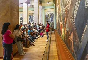 People viewing Katharsis 1934 mural by Jose Clemente Orozco