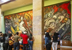 People viewing Katharsis 1934 mural by Jose Clemente Orozco
