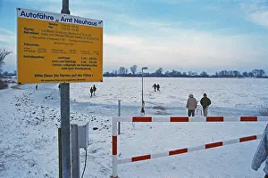 People walk across ice rink, ferry dock