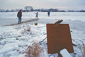 People walk across ice rink, ferry dock
