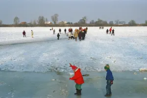 People walking across ice rink