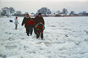 People walking across ice rink