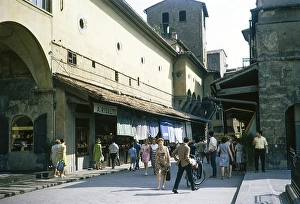 People watching on the street at the Ponte Vecchio bridge, Florence, Italy 1969
