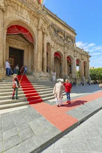 People wearing historical costumes at the entrance of Noto city hall
