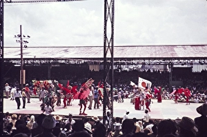 Performers in colourful costumes on stage as part of carnival celebrations, Port of Spain, Trinidad 1962 - captioned as Indian band wearing bat costumes