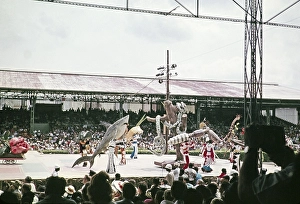 Performers in colourful costumes on stage as part of carnival celebrations, Port of Spain, Trinidad 1962 - captioned as Nature's Notebook
