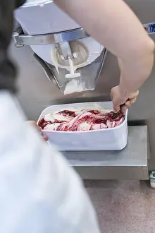 Category Historic EN Prints: A person packing fruit ice cream in a white container