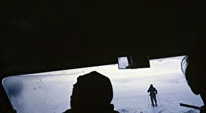 Person on skis guiding a vehicle over snow drifts, Gudmundur Jonasson travel company adventure Arctic expedition to the frozen ice cap, Iceland, 1972, Europe