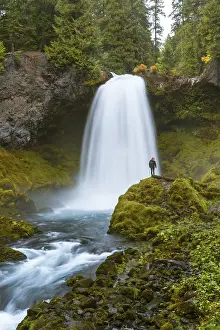 Person in front of a waterfall