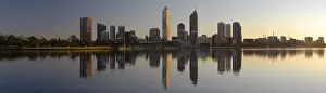 Perth Skyline reflected in Swan river in soft morning light