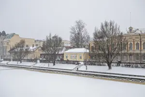 Pharmacy museum and other historic buildings on the frozen Aurajoki river