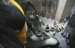 The Phra Atchana Buddha at Wat Si Chum is in the posture of Subduing Mara or Calling the Earth to