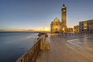 The Piazza Duomo with the famous cathedral in Trani in front of sunrise