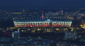 A picture of the PGE Narodowy Stadium at night