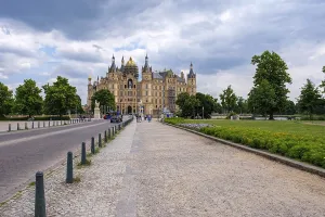 A picturesque castle with towers under a cloudy sky