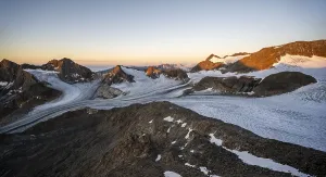 Picturesque high mountain landscape at sunrise with alpenglow