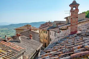 Picturesque italian village showing terracotta roofs and brick chimneys overlooking a valley
