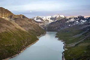 Picturesque mountain landscape at the summit Mont de la Blana at sunset with full moon