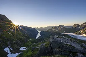 Picturesque mountain landscape at sunrise with sun star