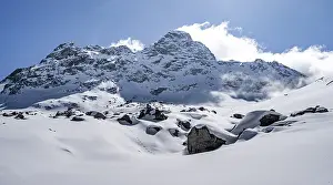 Picturesque snow-covered mountain landscape with Piz Kesch summit