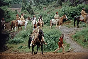 Pierre Brice as Winnetou and other actors riding horses in The Treasure in Silver Lake