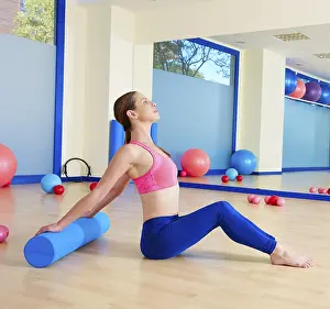 Category Historic EN Prints: Pilates woman roller exercise workout at gym indoor