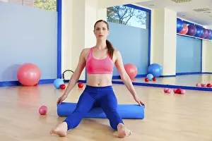 Category Historic EN Prints: Pilates woman roller sit roll exercise workout at gym indoor