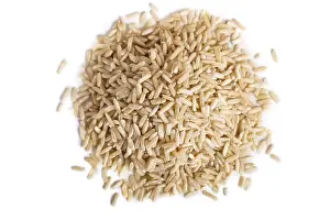 Pile of brown rice isolated on white background
