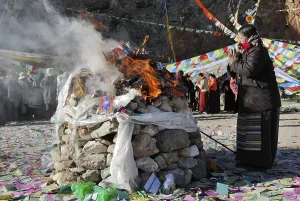 Category Buddhism Prints: Pilgrim praying during a ceremony at Namtso Lake