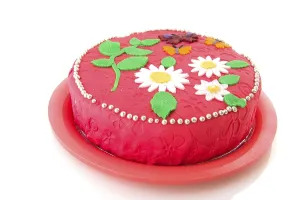 Pink birthday cake with flowers and butterflies
