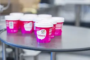 Category Historic EN Prints: Several pink raspberry-flavoured sundaes standing close together on the table