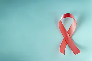 Pink ribbon - a symbol of the fight against breast cancer on a blue background