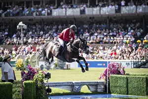 Category Historic EN Prints: Pius Schwizer of Switzerland and riding Vancouver De Lanlore compete in the first round of the 1