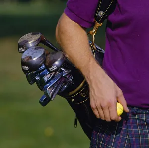 Player with golf bag with club tee and balls