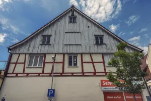 Pointed gable facade with half-timbering and timber panelling