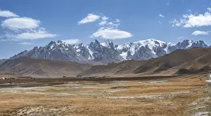 Pointed high mountain peaks with glaciers